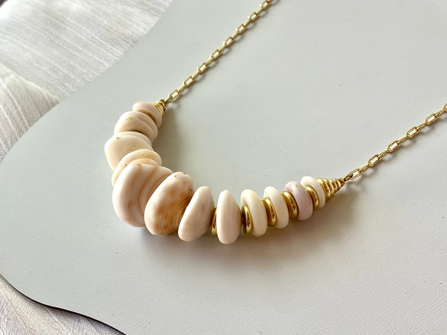 Graduated Puka Halo Necklace